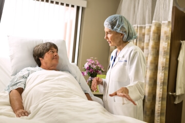 Dr. Boylan talks with a patient at St. Luke's.